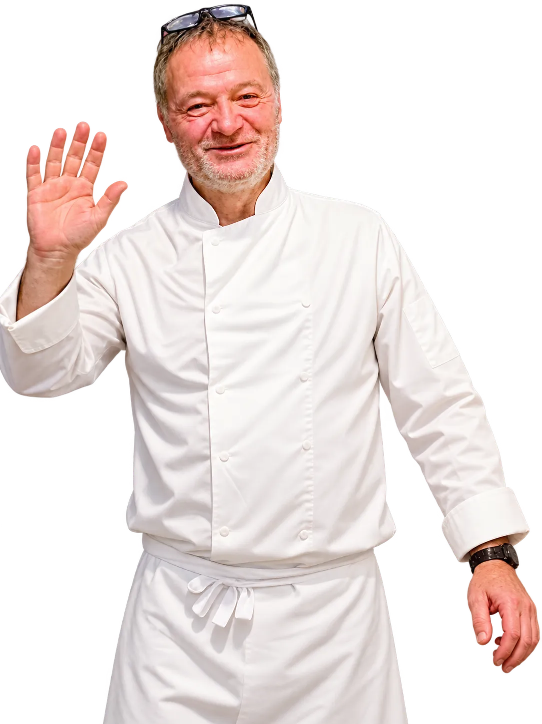 Chef Philippe in his white chef’s jacket, smiling and waving